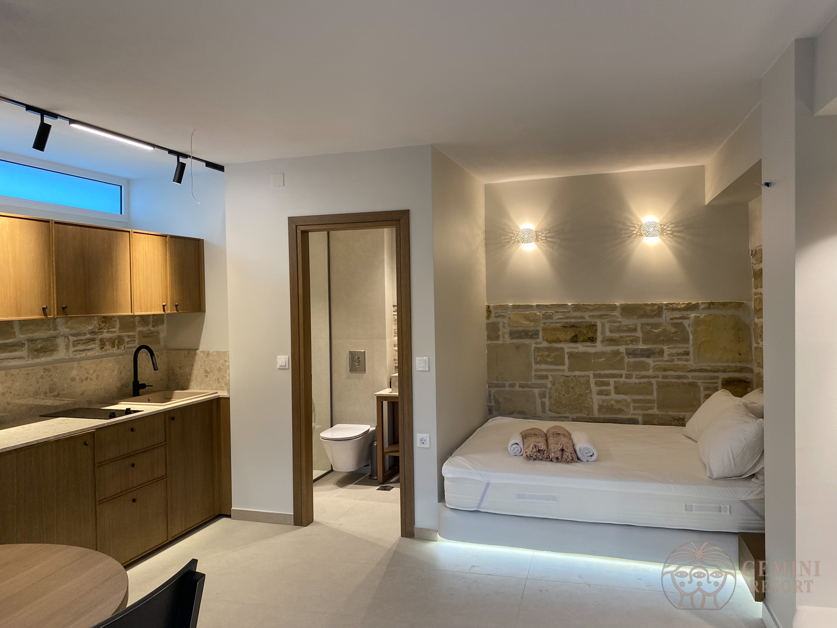 The kitchen, the entrance of the bathroom and the bedroom in the lower ground floor 2